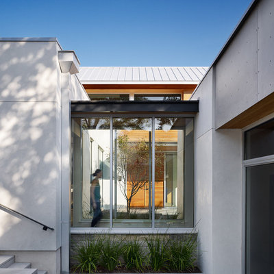 Trendy entryway photo in Austin with a glass front door
