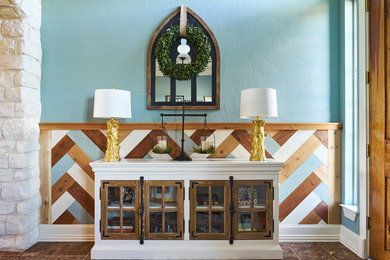 Eclectic foyer photo in Dallas with blue walls and a medium wood front door