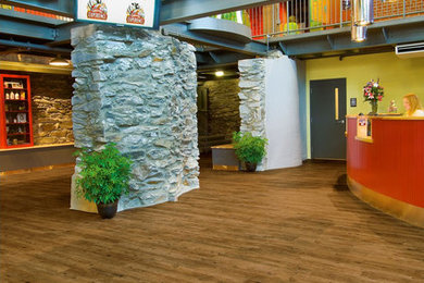 Example of a large mountain style vinyl floor foyer design in Seattle with yellow walls