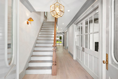 Inspiration for a contemporary light wood floor and gray floor entryway remodel in New York