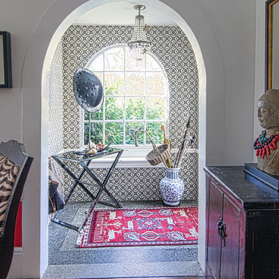 Eclectic entryway photo in San Francisco with white walls