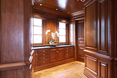 Example of a transitional medium tone wood floor vestibule design in Los Angeles