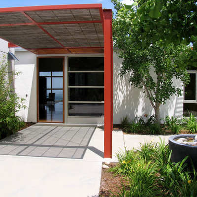 Inspiration for a contemporary entryway remodel in San Francisco with a glass front door