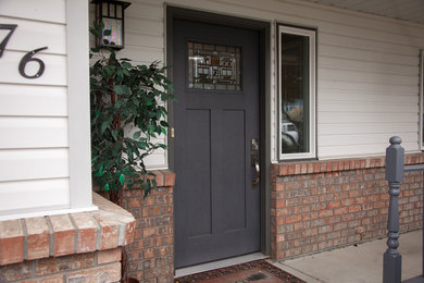 Entryway photo in Vancouver with a gray front door