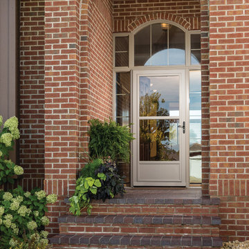 Screen Away® Almond Door on Brick Home