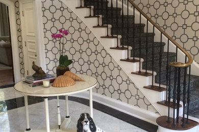 Inspiration for a mid-sized transitional marble floor foyer remodel in DC Metro with white walls
