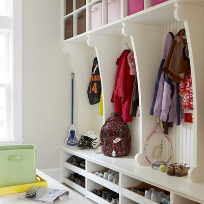 Large elegant gray floor mudroom photo in Boston with white walls