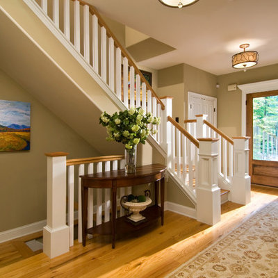 Inspiration for a timeless entryway remodel in New York with a glass front door and green walls