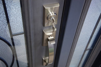 Contemporary front door in Vancouver with a single front door and a blue front door.