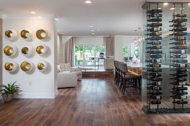 This is an example of a large modern foyer in Tampa with white walls, medium hardwood flooring, a double front door, a dark wood front door and brown floors.