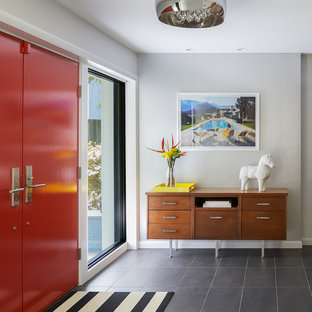 Entryway - large 1950s slate floor and gray floor entryway idea in DC Metro with gray walls and a red front door