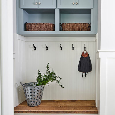 Inspiration for a transitional dark wood floor mudroom remodel in Seattle with white walls