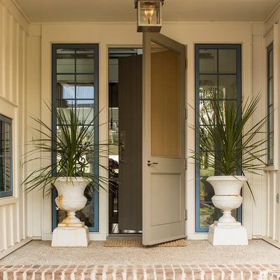 Inspiration for a coastal entryway remodel in Charlotte with a gray front door