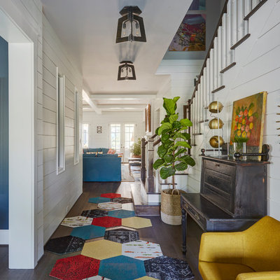 Country dark wood floor and brown floor entry hall photo in Houston with white walls