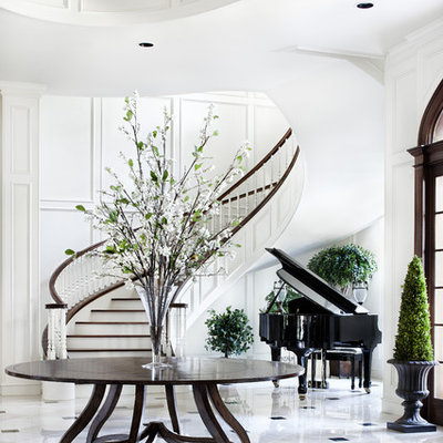 Inspiration for a huge timeless marble floor foyer remodel in Austin with white walls