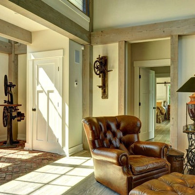 Large farmhouse brick floor entryway photo in Burlington with beige walls and a white front door