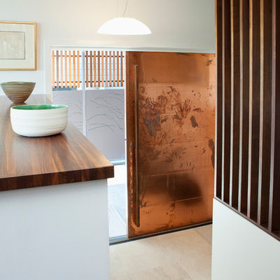 Entryway - mid-sized contemporary marble floor entryway idea in Brisbane with white walls and a metal front door