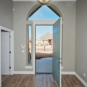 Spacious Entry with Arched Window above Door