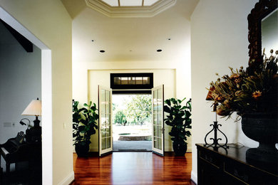 Elegant medium tone wood floor foyer photo in San Francisco
