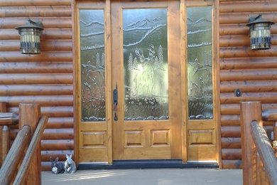Example of a mid-sized mountain style light wood floor and gray floor entryway design in Phoenix with a light wood front door and brown walls