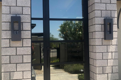 Example of an entryway design in Phoenix with a black front door