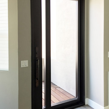 Steel Entry Pivot Door - Worley Residence