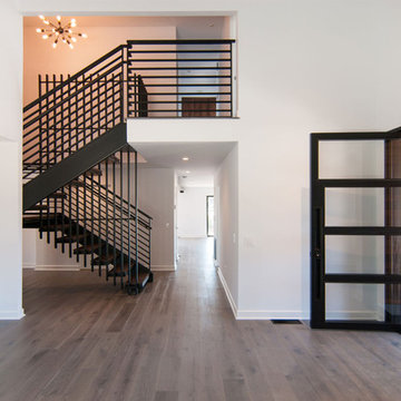 Steel Pivot Door and Steel Staircase - Stevens Residence