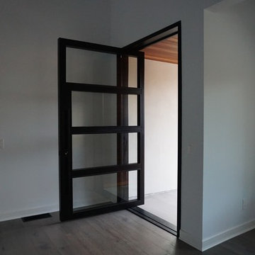 Steel Pivot Door - Stevens Residence