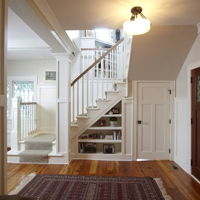 Inspiration for a mid-sized timeless light wood floor single front door remodel in Tampa with beige walls and a medium wood front door
