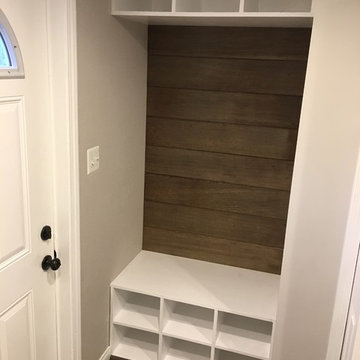 Storage nook with reclaimed weathered clear cedar siding