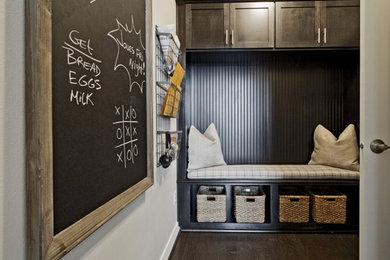 Inspiration for a mid-sized contemporary dark wood floor mudroom remodel in Seattle with gray walls