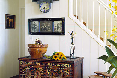 Inspiration for a mid-sized eclectic carpeted entryway remodel in Los Angeles with white walls
