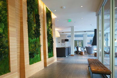 Example of a large minimalist ceramic tile entryway design in Minneapolis