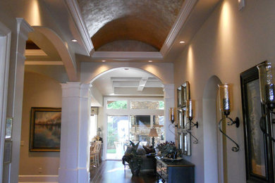 Foyer - mid-sized traditional dark wood floor foyer idea in Portland with beige walls