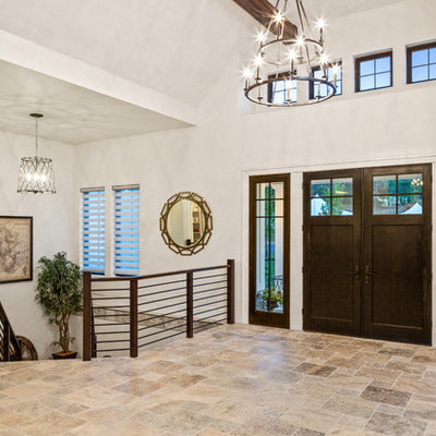 Entryway - huge cottage travertine floor and multicolored floor entryway idea in Cincinnati with white walls and a black front door