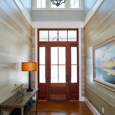 Example of a mid-sized transitional medium tone wood floor entryway design in Charleston with a medium wood front door
