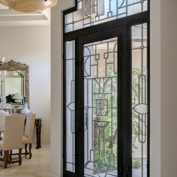 This Art Deco Home added a mosaic marble rug inset to marble floors.