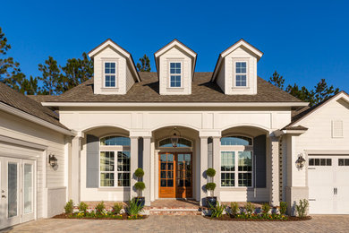 Inspiration for a large timeless entryway remodel in Jacksonville with a glass front door