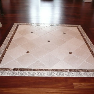 Tile inset in wood floor entry