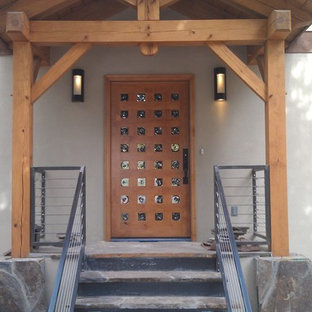 Small trendy entryway photo in Albuquerque with a medium wood front door