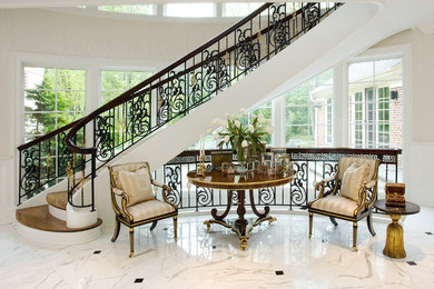 Foyer - large traditional marble floor foyer idea in New York with white walls