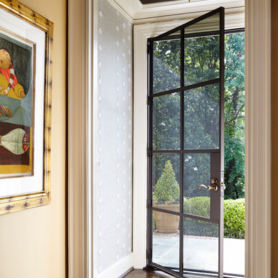 Example of a small transitional dark wood floor single front door design in Atlanta with a glass front door