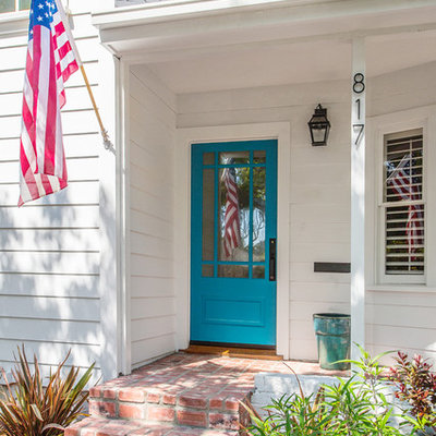 Example of a classic single front door design in Los Angeles with a blue front door