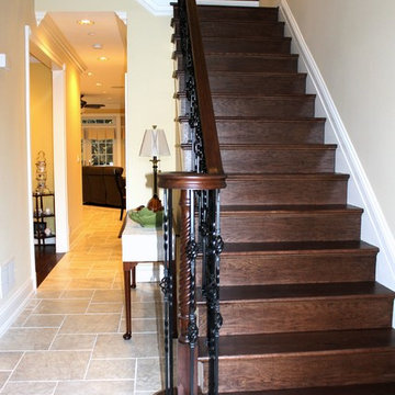 Traditional Mediterranean Home With Custom Staircase and Railing