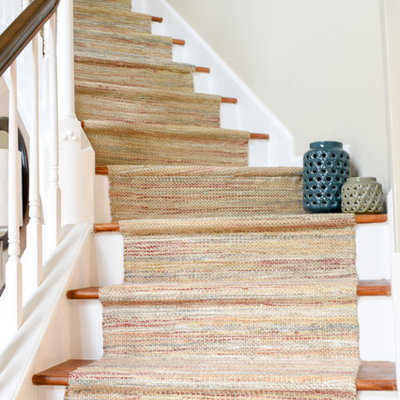 Example of a large transitional medium tone wood floor foyer design in Nashville with beige walls