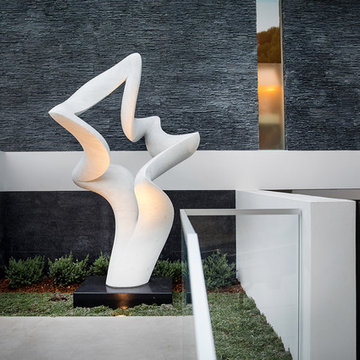 Trousdale Beverly Hills luxury home entrance with modern sculpture by Richard Er
