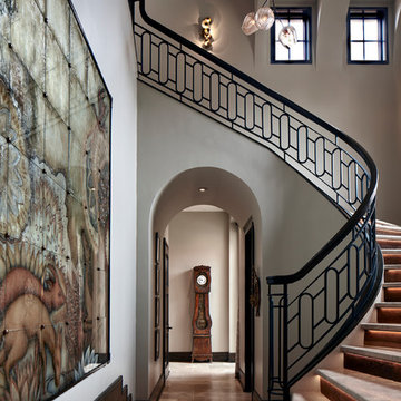 Two-Story Foyer with Curved Staircase with Metal Railing