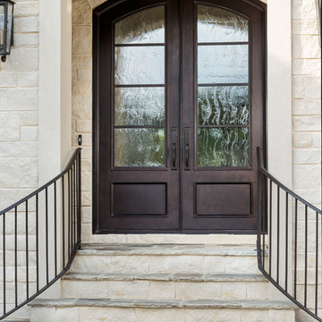 Double Doors Featuring the Warmth of Wood But The Durability of Wrought Iron