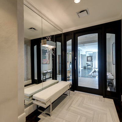 Example of a mid-sized transitional porcelain tile and white floor entryway design in Dallas with a glass front door and beige walls