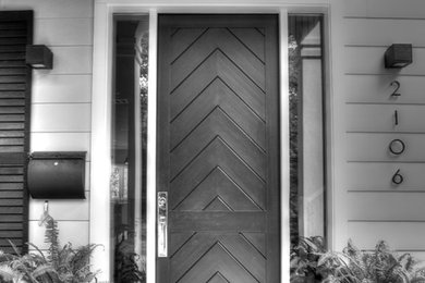 Photo of a medium sized classic front door in Austin with a dark wood front door.